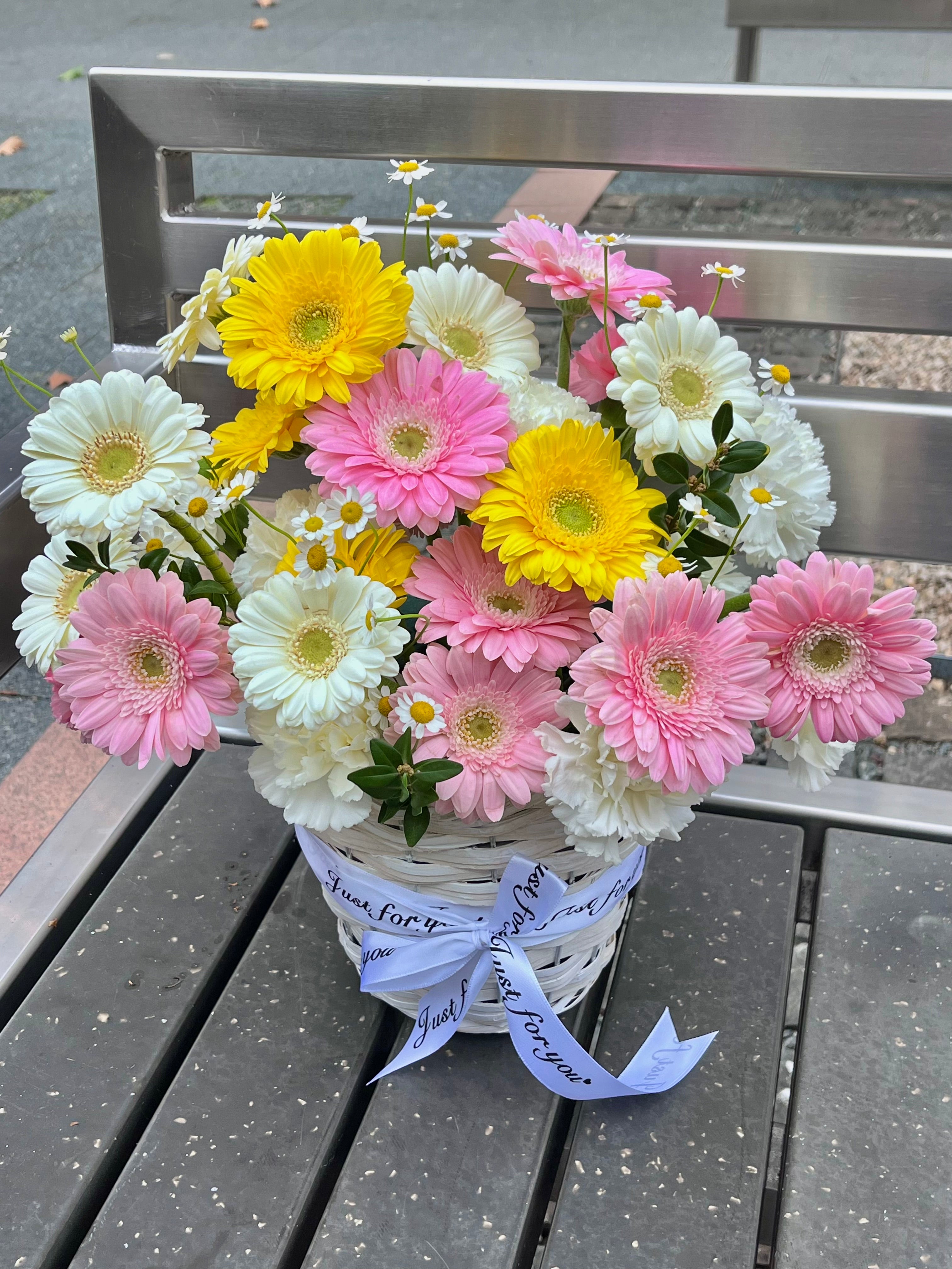 Pink, yellow and cream gerbera daisy flower basket with white daisies and carnations, made by Wonder by Alice florist in Canberra Centre